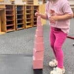 Colorful Montessori stepping stones activity for developing balance and coordination in young children at Mount Clemens, MI daycare and preschool.
